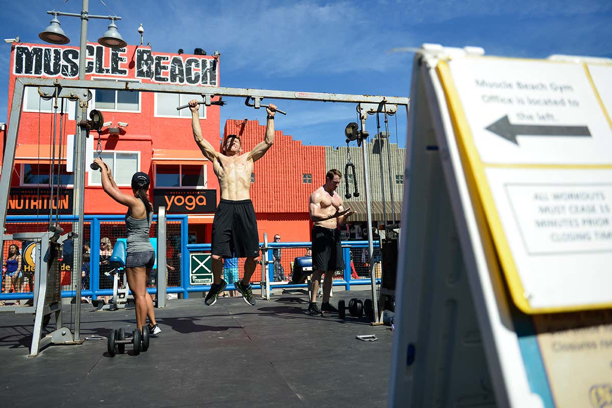 man lifting loads of weight