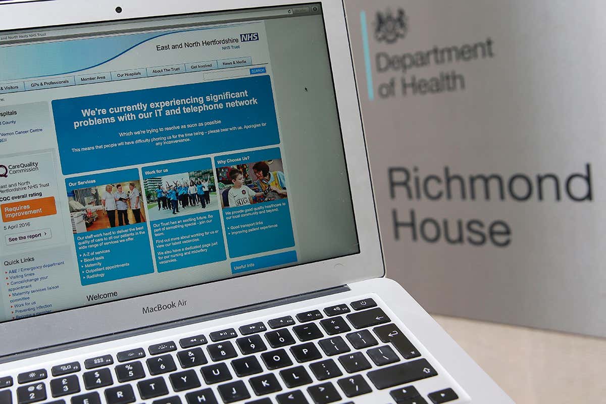 a laptop with NHS site open