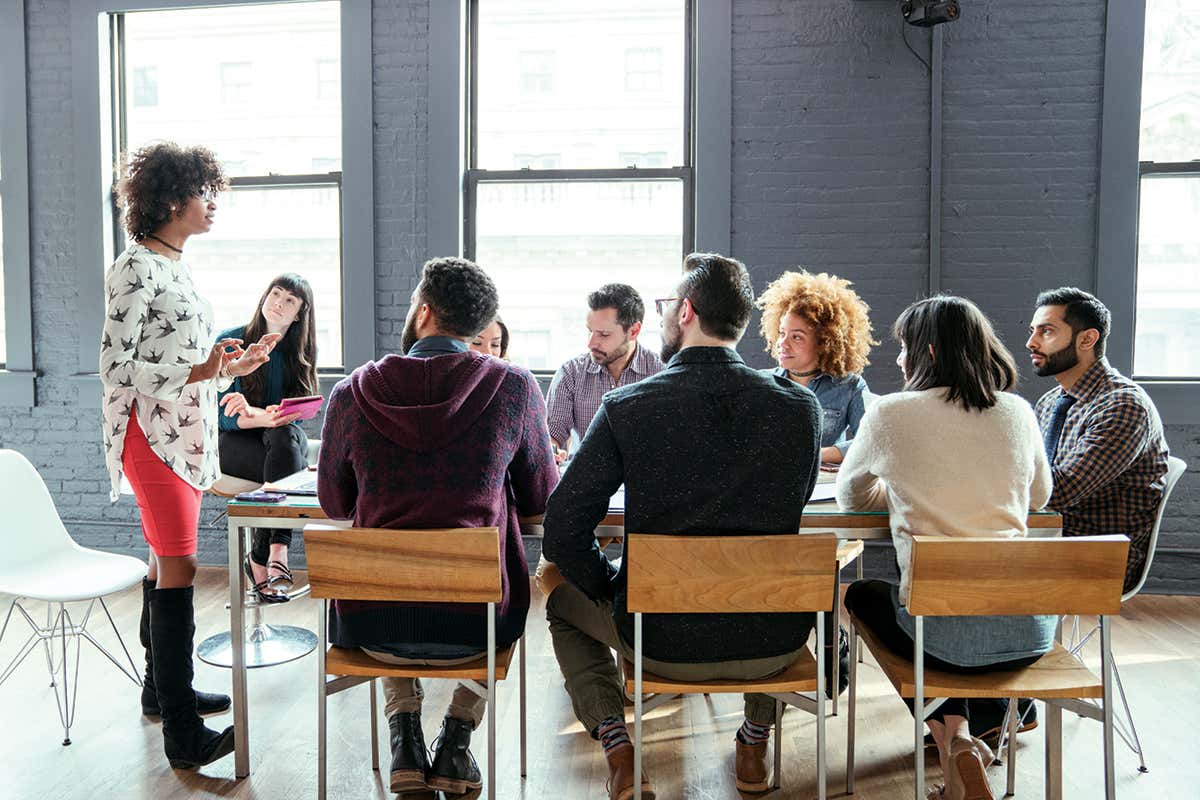 A woman addresses a meeting