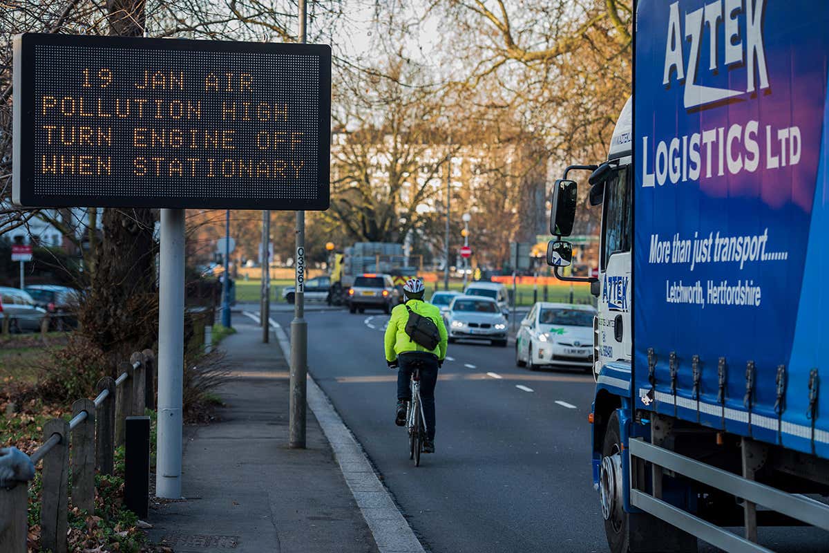 A cyclist on a busy road