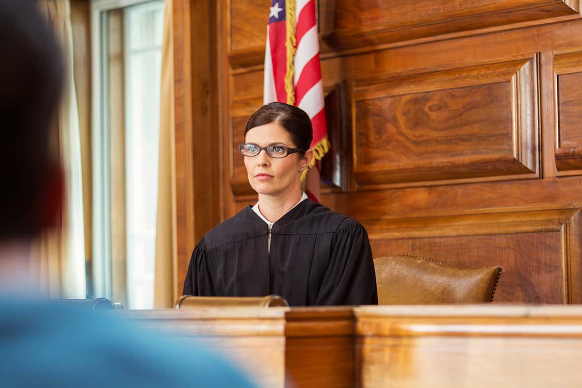 A judge sitting in a courtroom