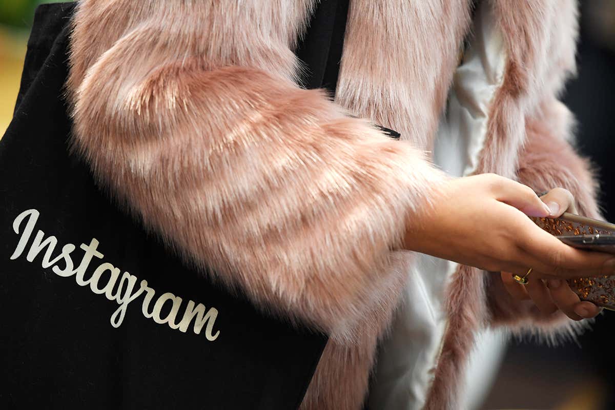 Person with Instagram bag