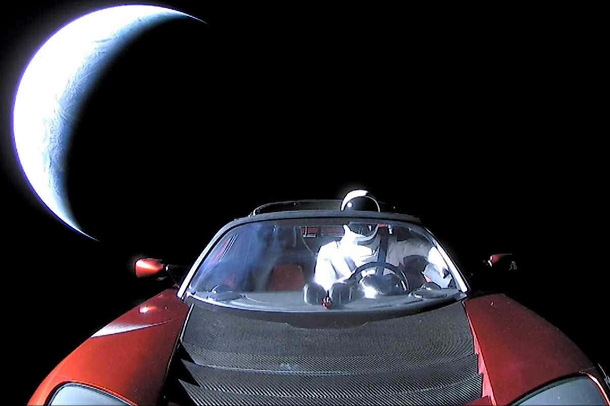 Tesla car with Earth as backdrop