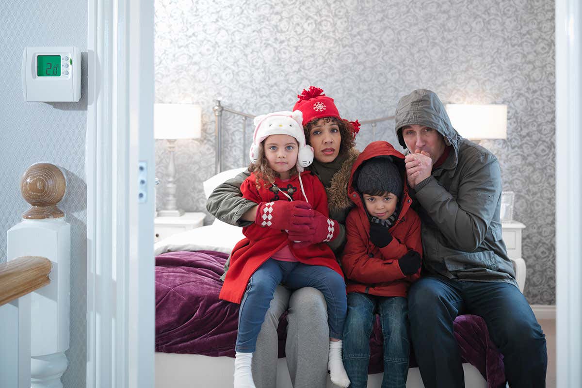 A family wrap up warm