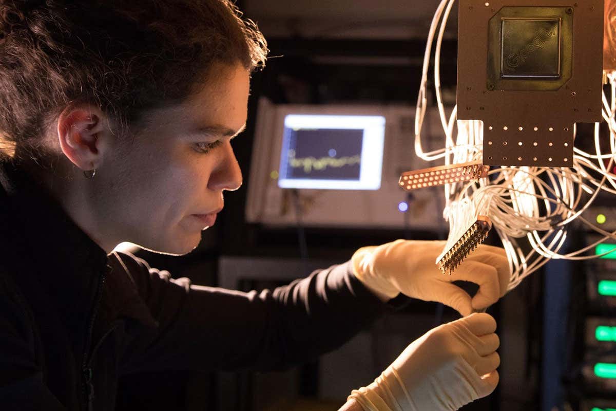 A Bristlecone chip being installed by Research Scientist Marissa Giustina at the Quantum AI Lab in Santa Barbara