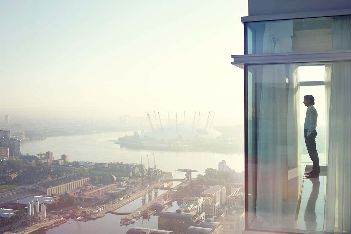 A man looking out a window