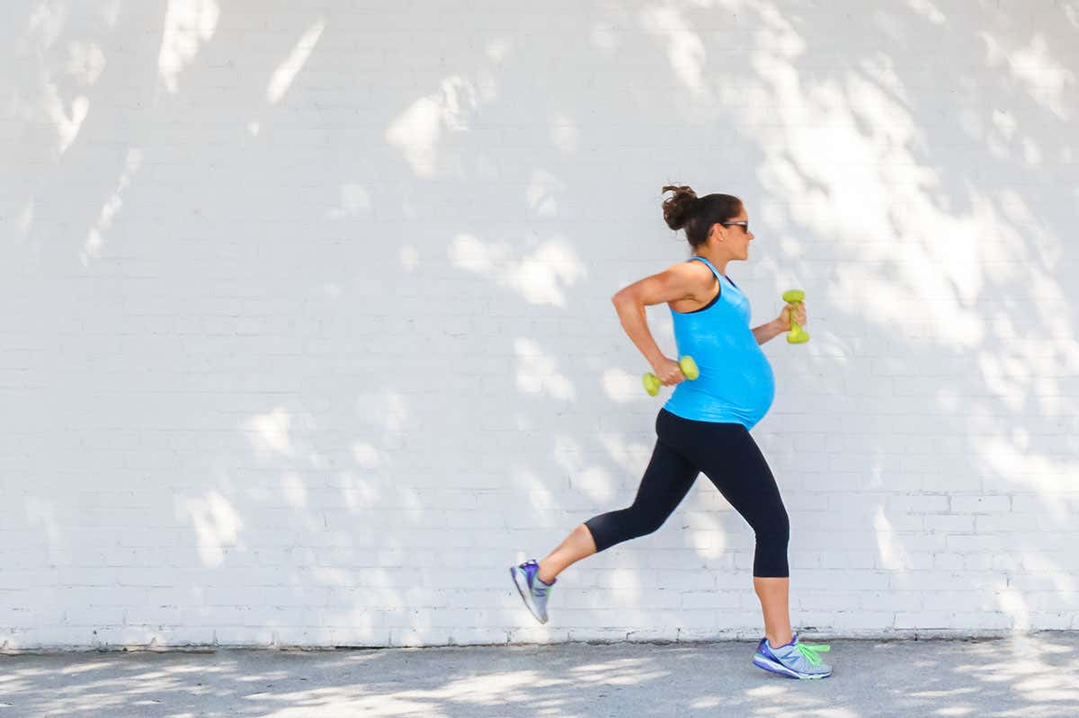 A pregnant woman jogging