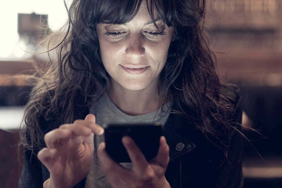 A lady looking at her smartphone