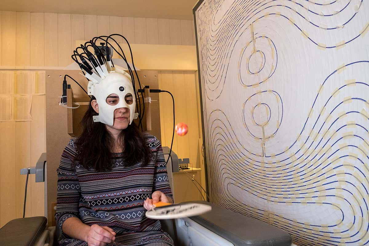 A person wearing a portable brain scanner