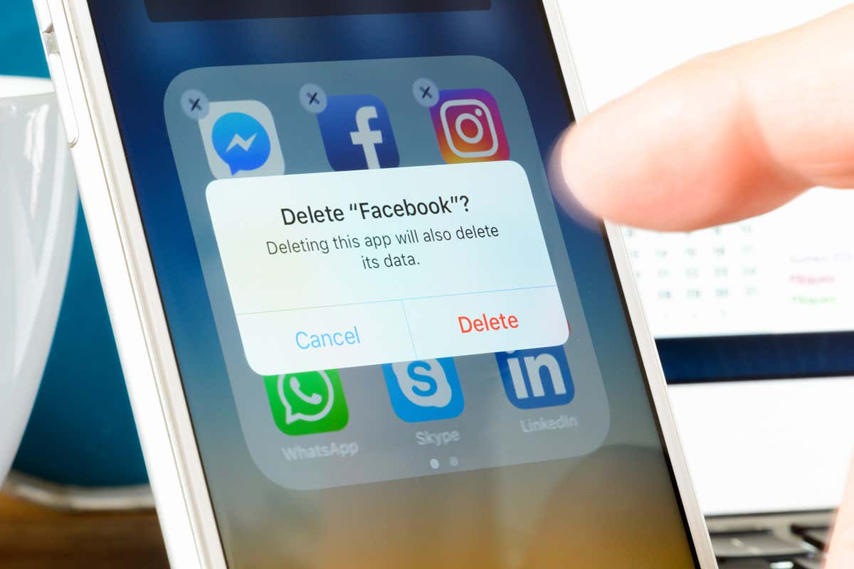 User deletes Facebook app from iPhone. The social media platform faces increased scrutiny around personal data privacy