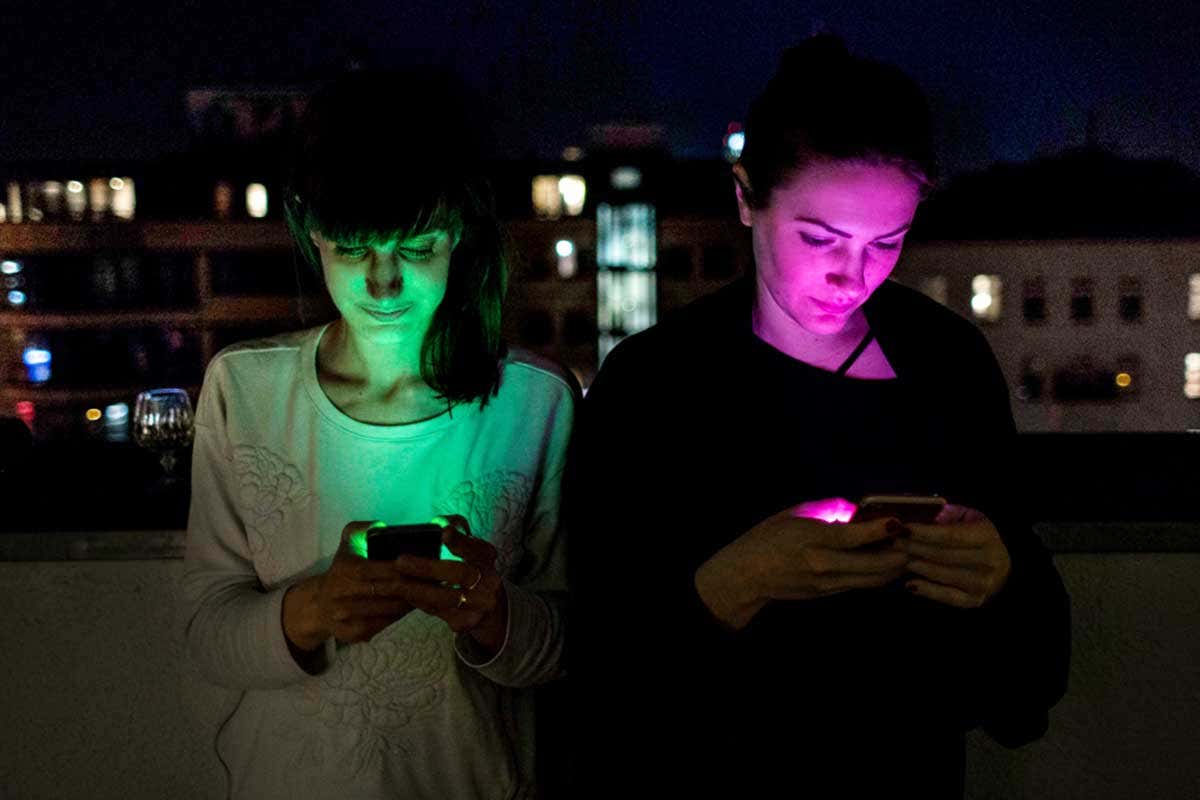 Two women looking at their phones