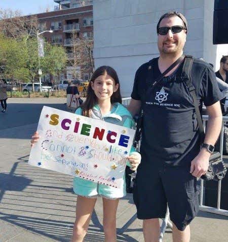 Dakota Shanley, 10, and her father at the New York March for Science