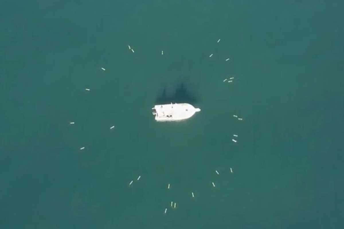 SwarmDiver drones close in on a boat