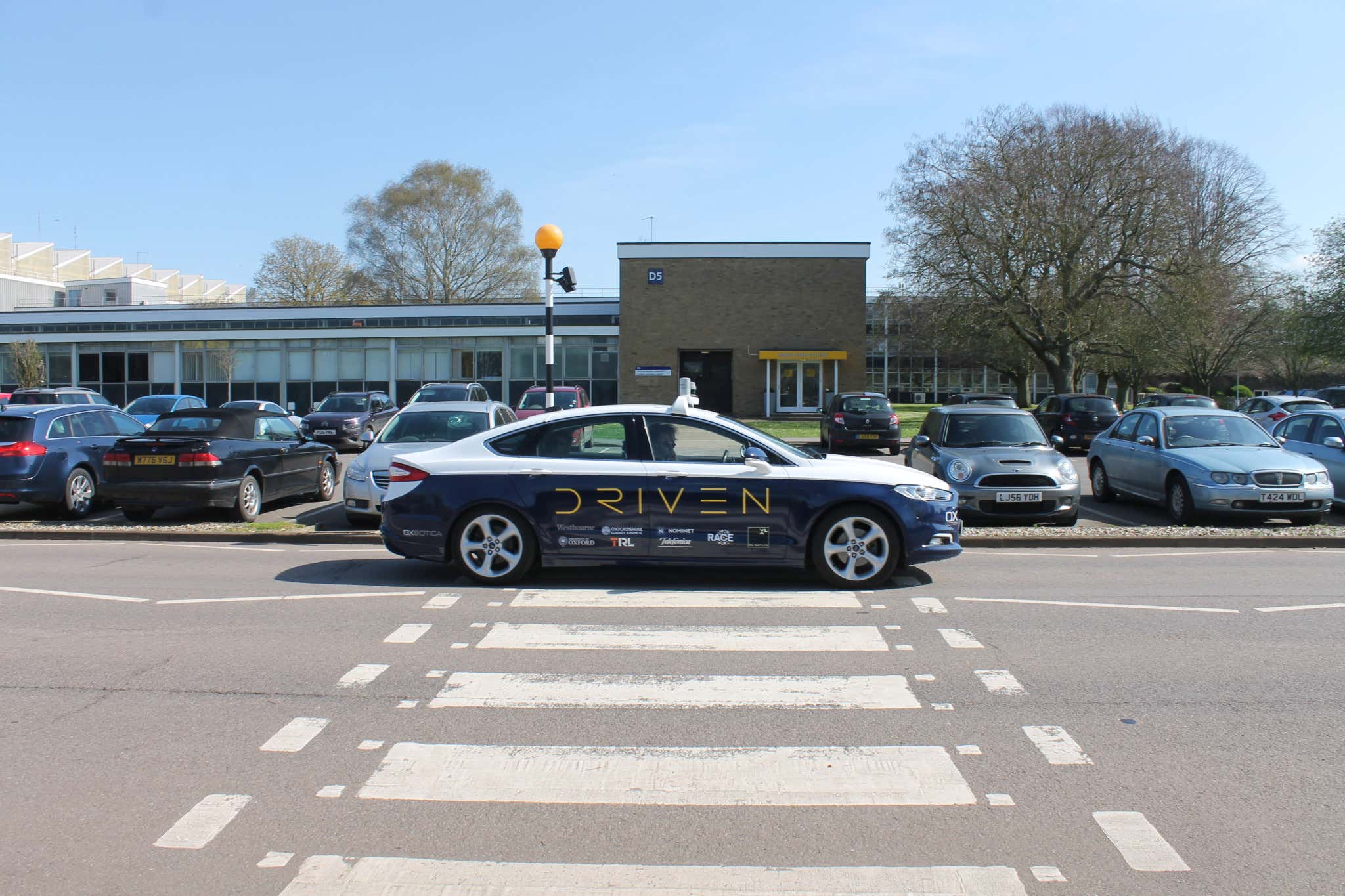 DRIVEN's driverless car drives past a pedestrian crossing