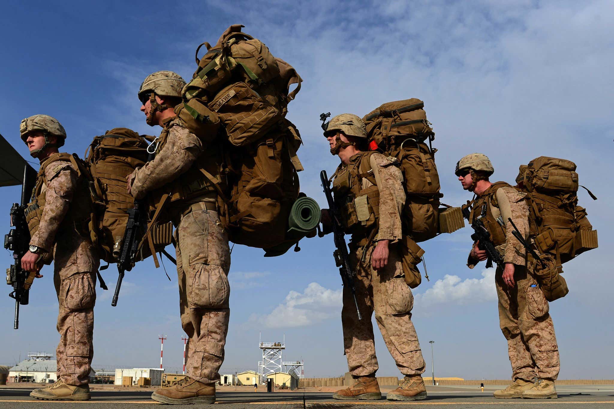 Four soldiers where big back packs