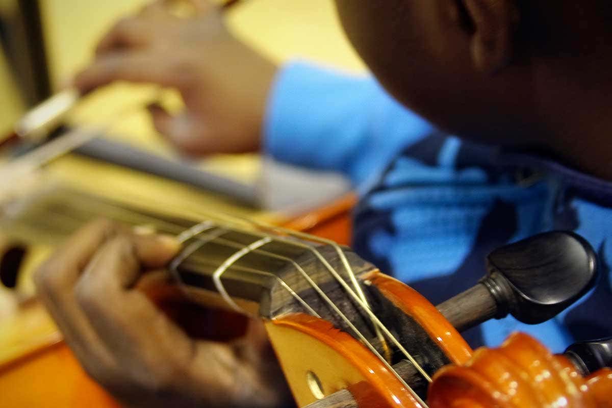 A person playing a string instrument