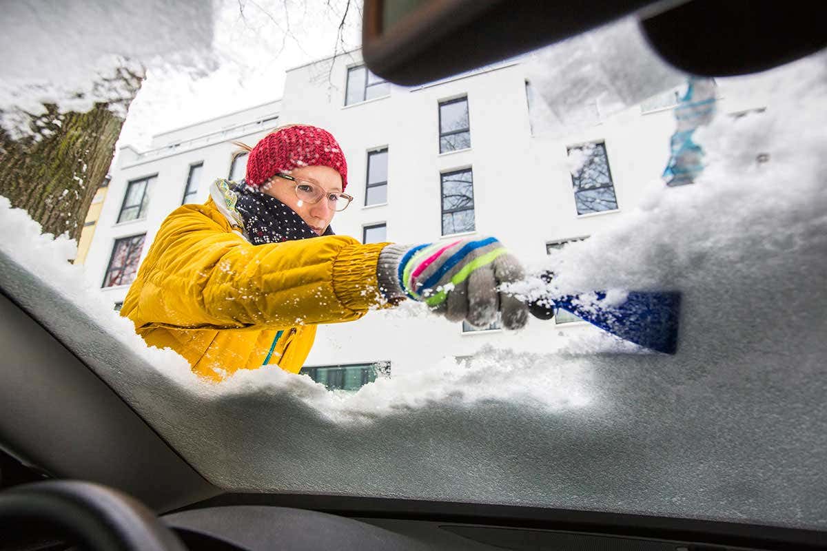 Scraping ice off car window