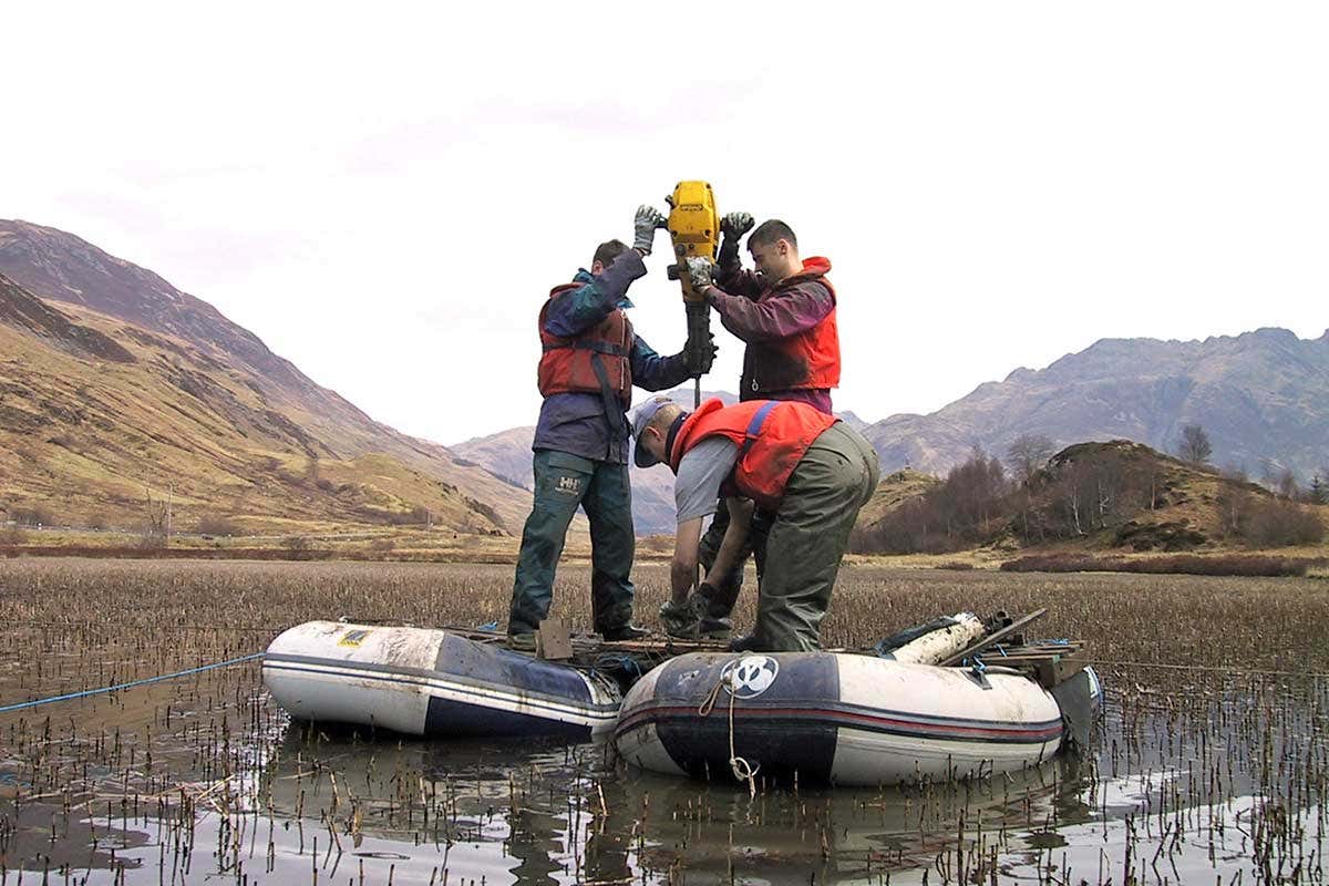 The team sample soil cores in a lake in Scotland 