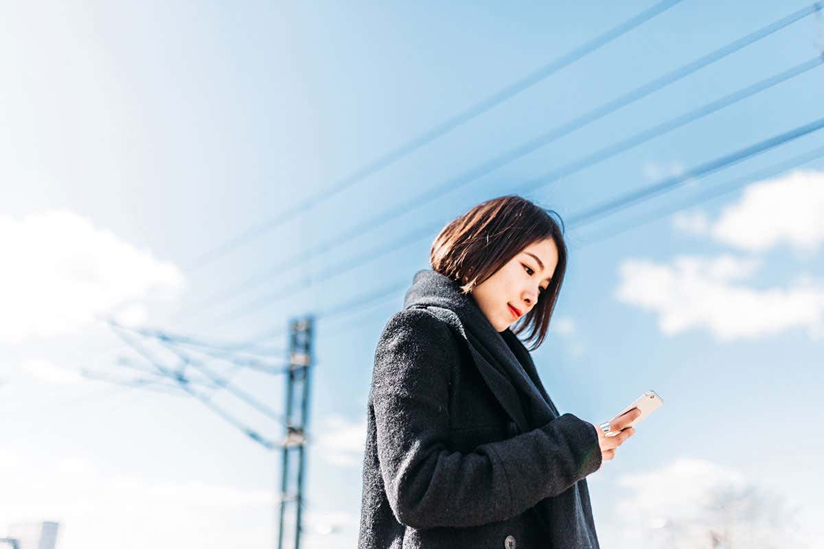 A woman looking at a phone