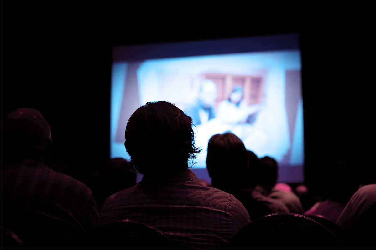Two people watching a film