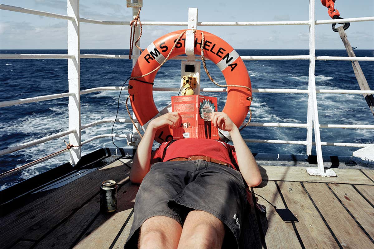 person reading on boat