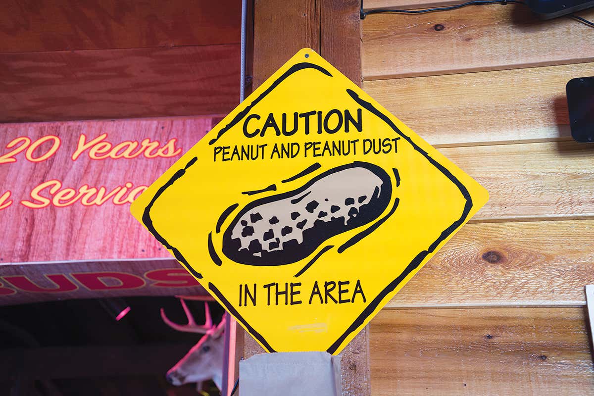 sign warning of peanut dust in the area