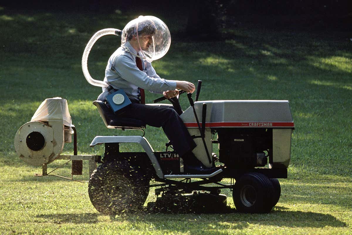 man on lawnmower