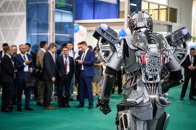 A robot looks at a crowd