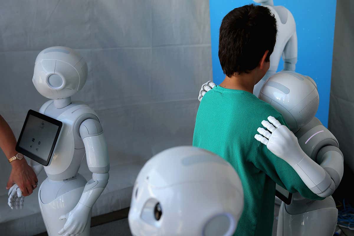 a robot hugs a person