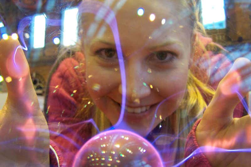 Melanie looking at us through one of those plasma balls people buy in shops