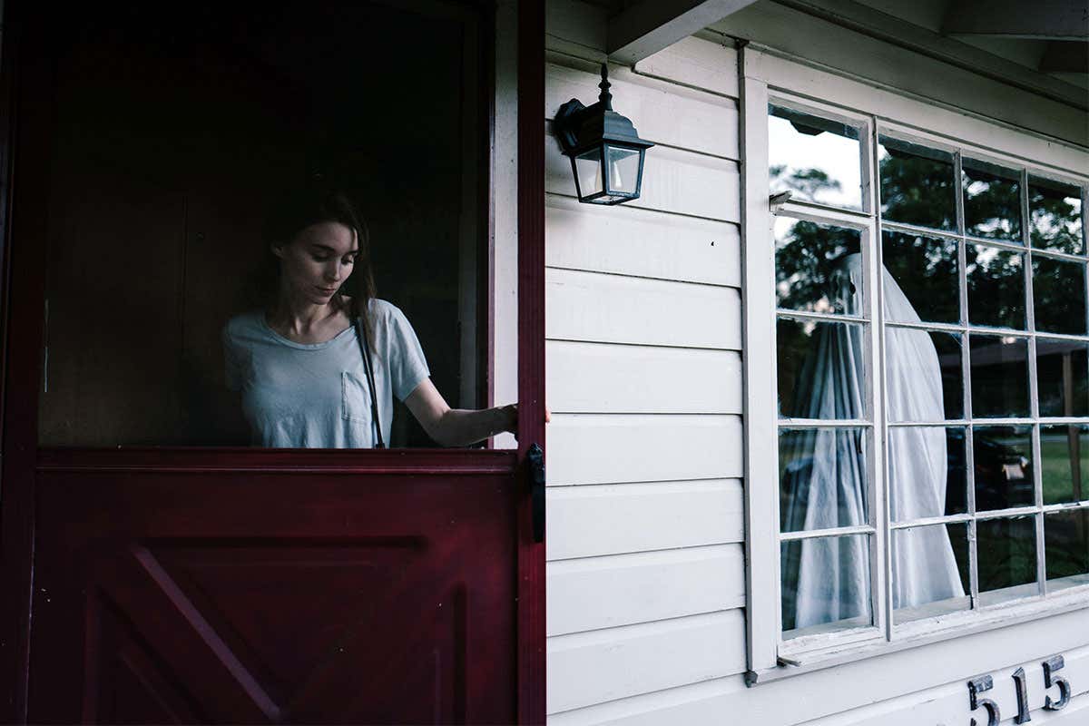 A woman walking through a door