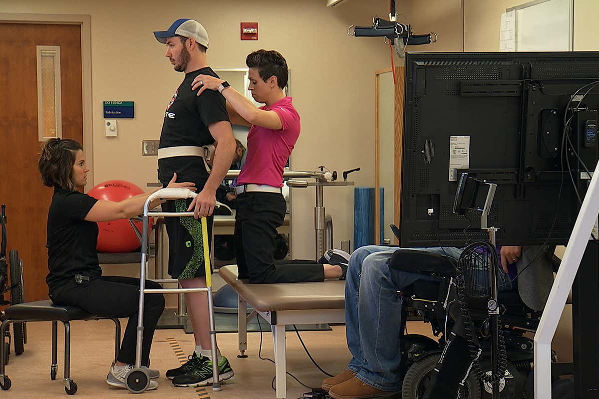 Three people with paralysis can walk again with nerve-boosting implant