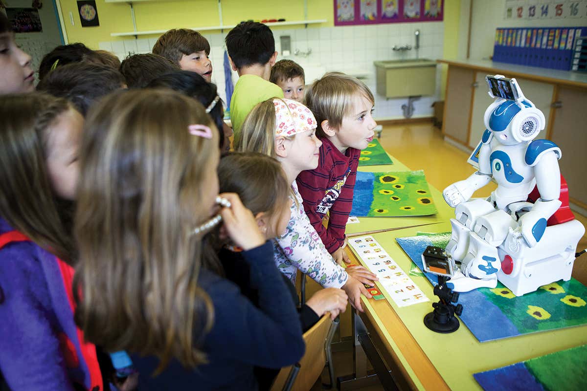 A robot captivates a group of children