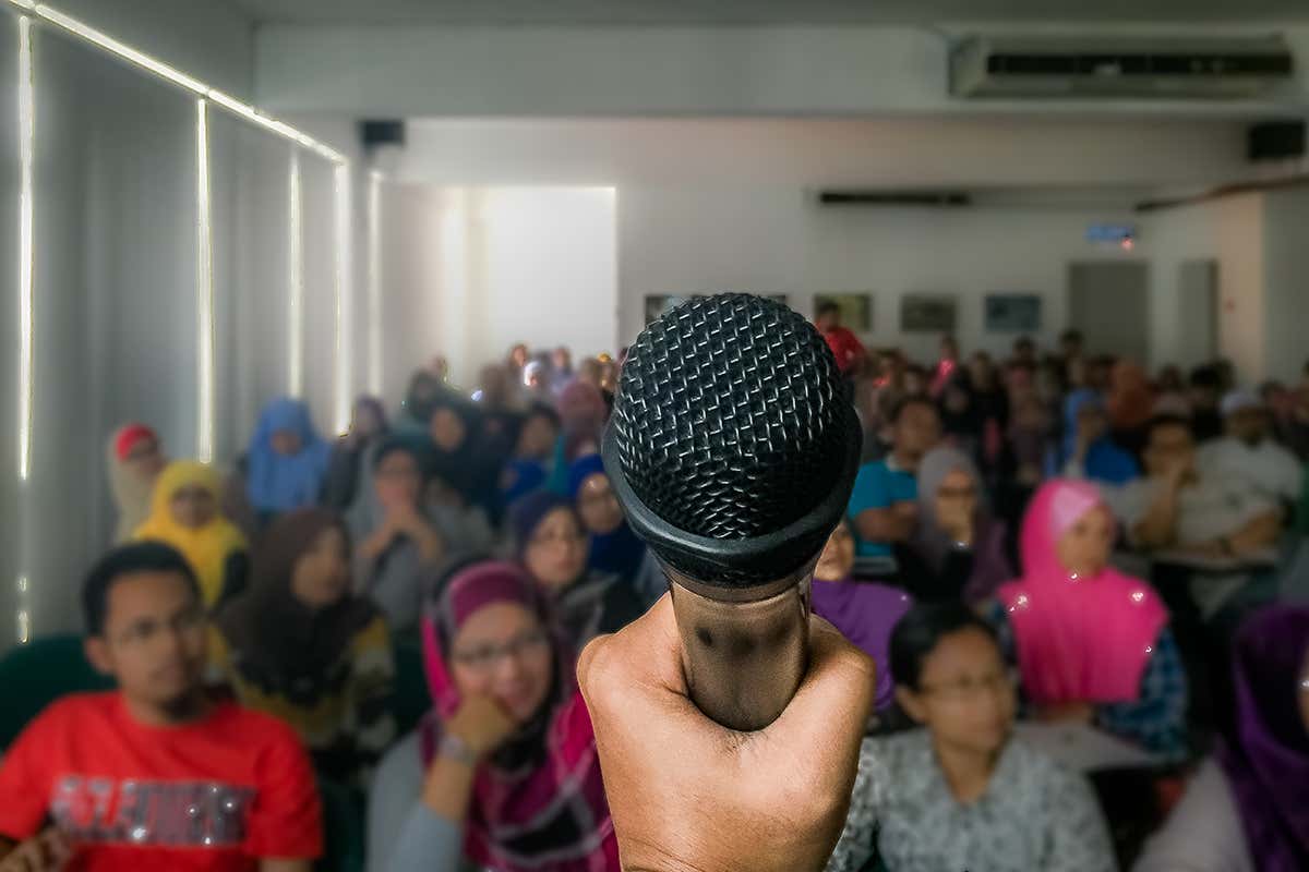 A microphone in front of a group of people