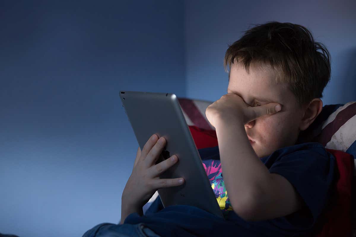 A child looking at a tablet