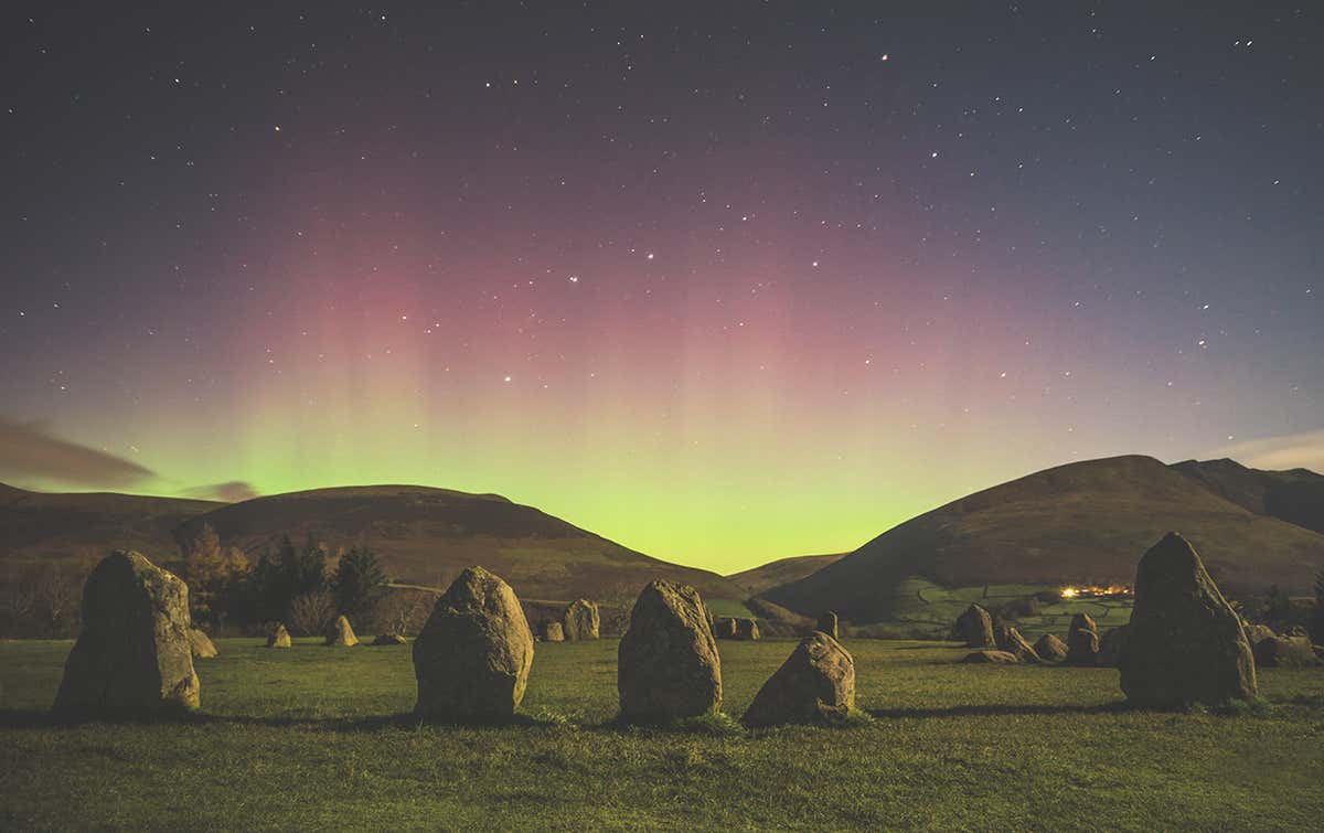 Castlerigg Stone Circle and an aurora in the background