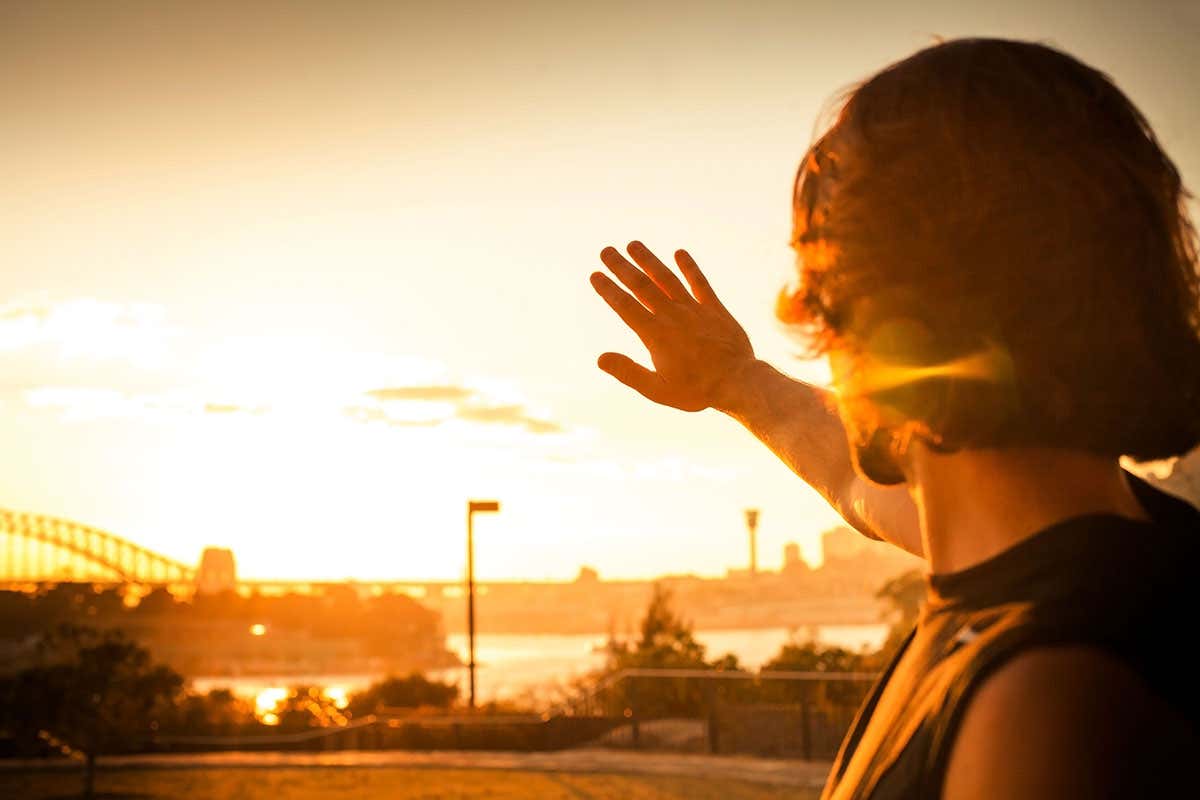 A person looks at the sun