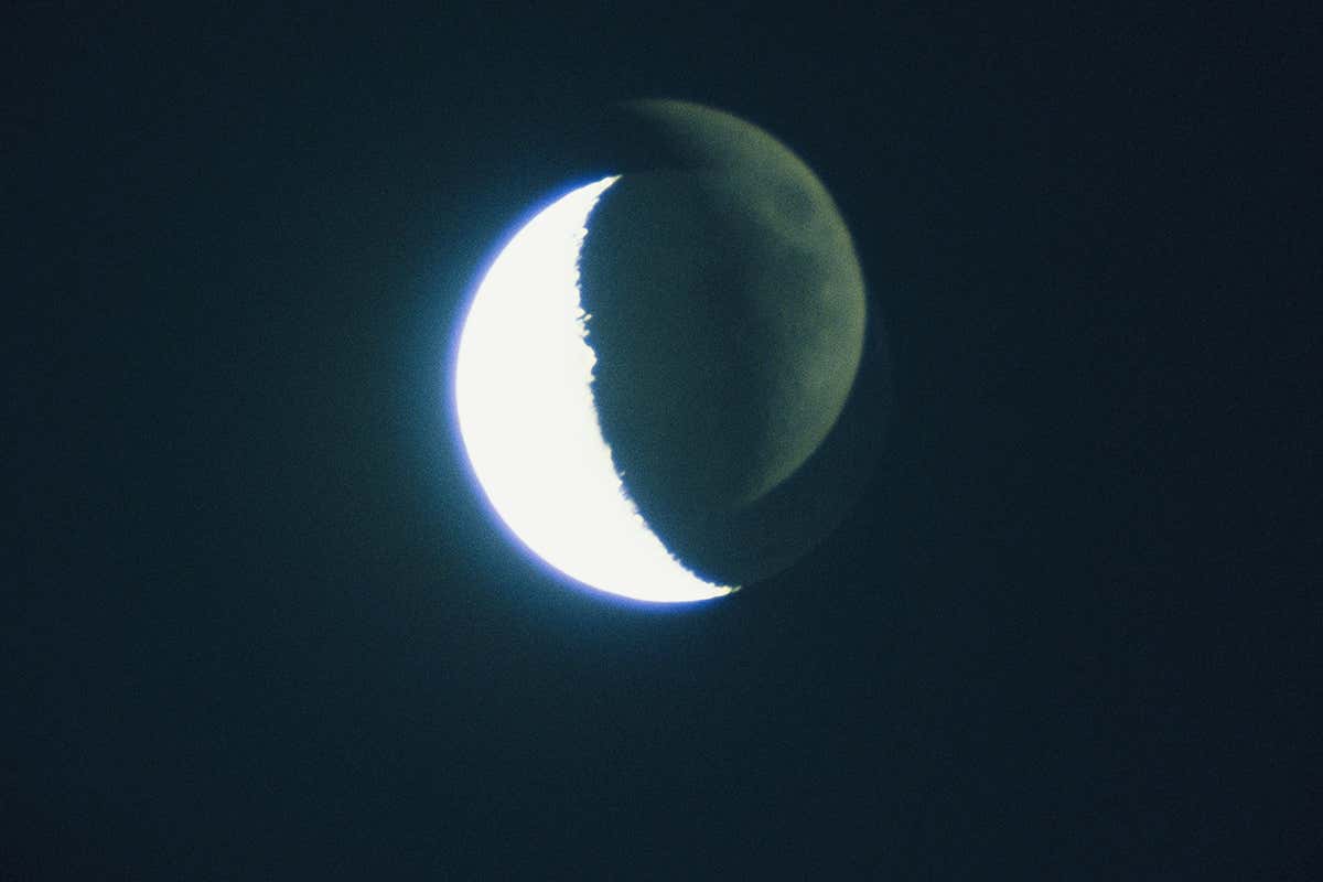 A mysterious picture of a moon behind the moon