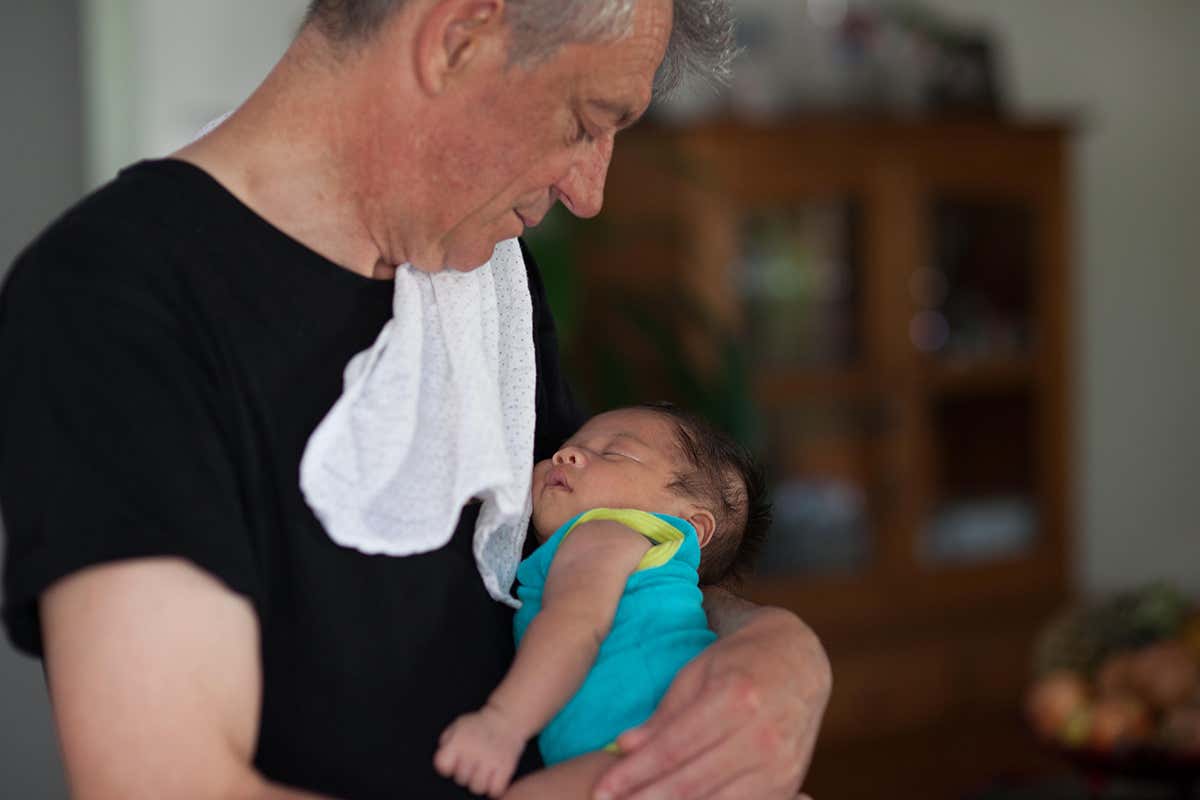 A father holder a baby