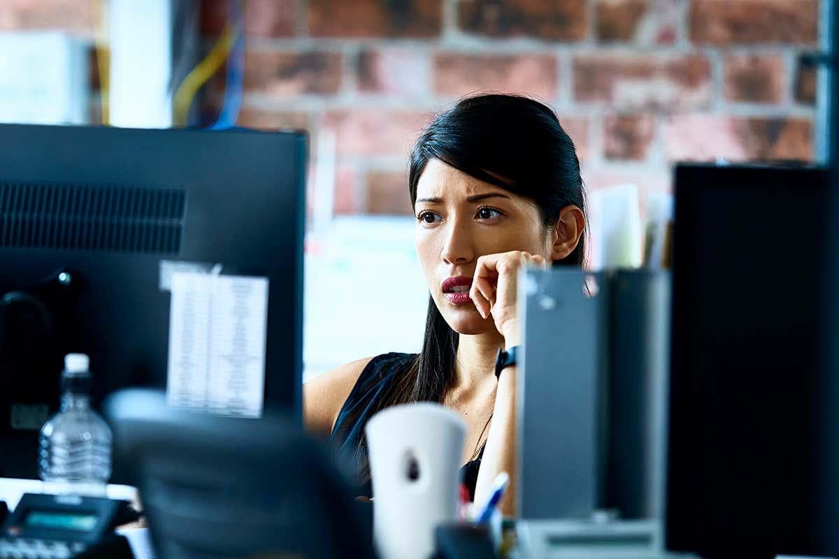 Woman using computer in modern office