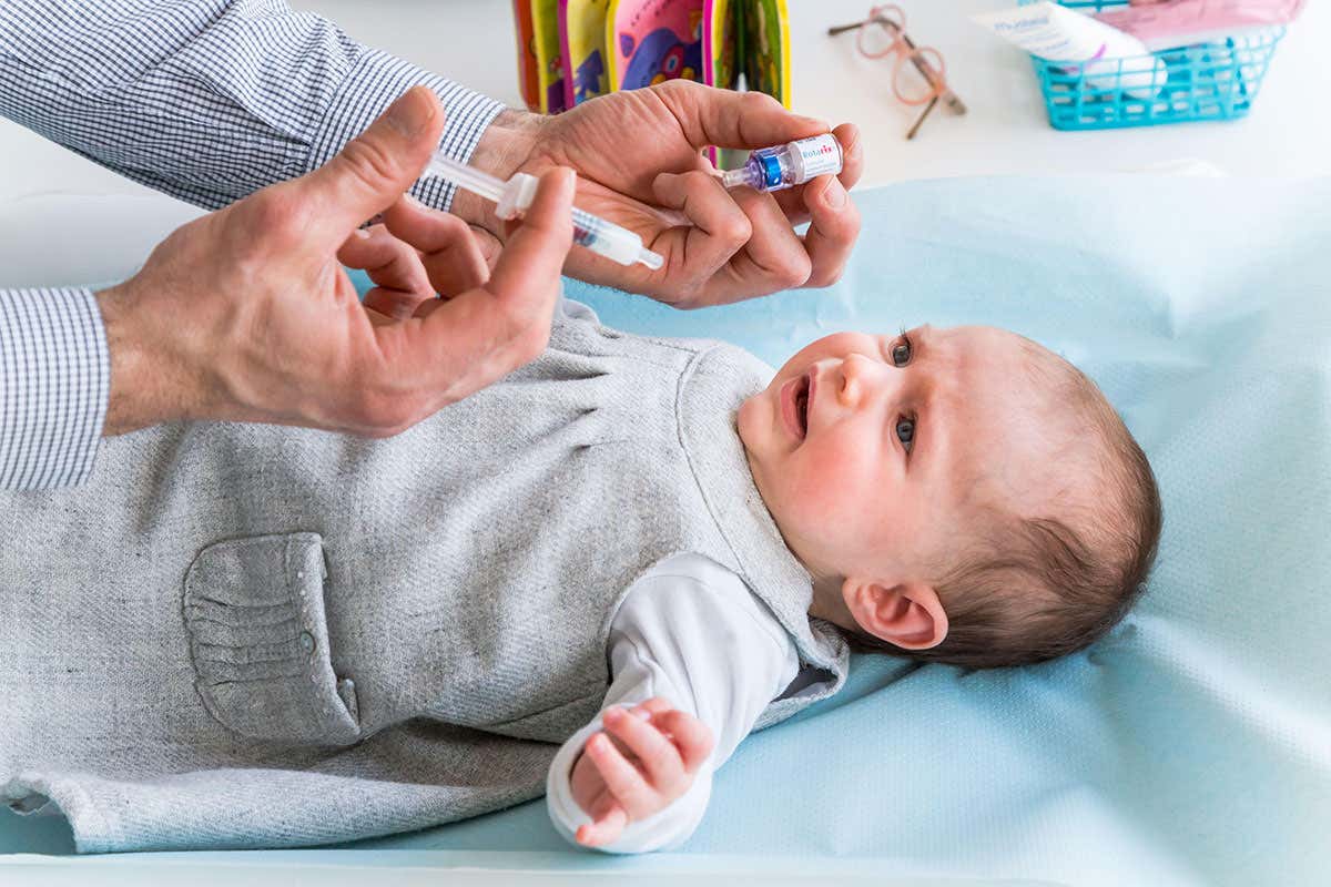 A baby receives a vaccine