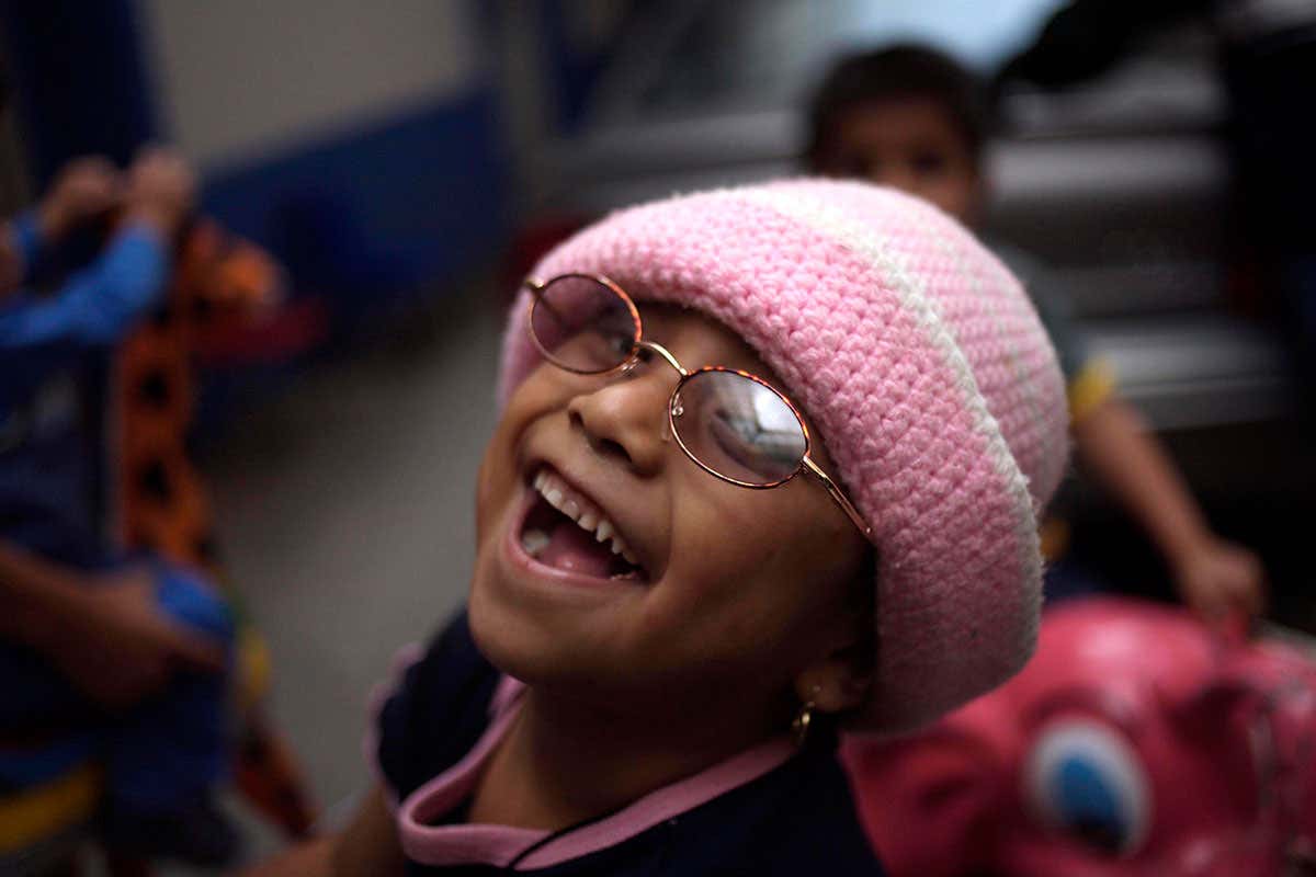 Cecilia Hipolito Lucas, who suffers retinoblastoma plays in a shelter for chronically ill children in Mexico City, Mexico