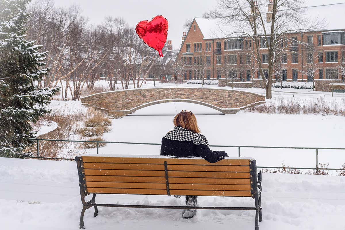 Lady on bench with heart ballon