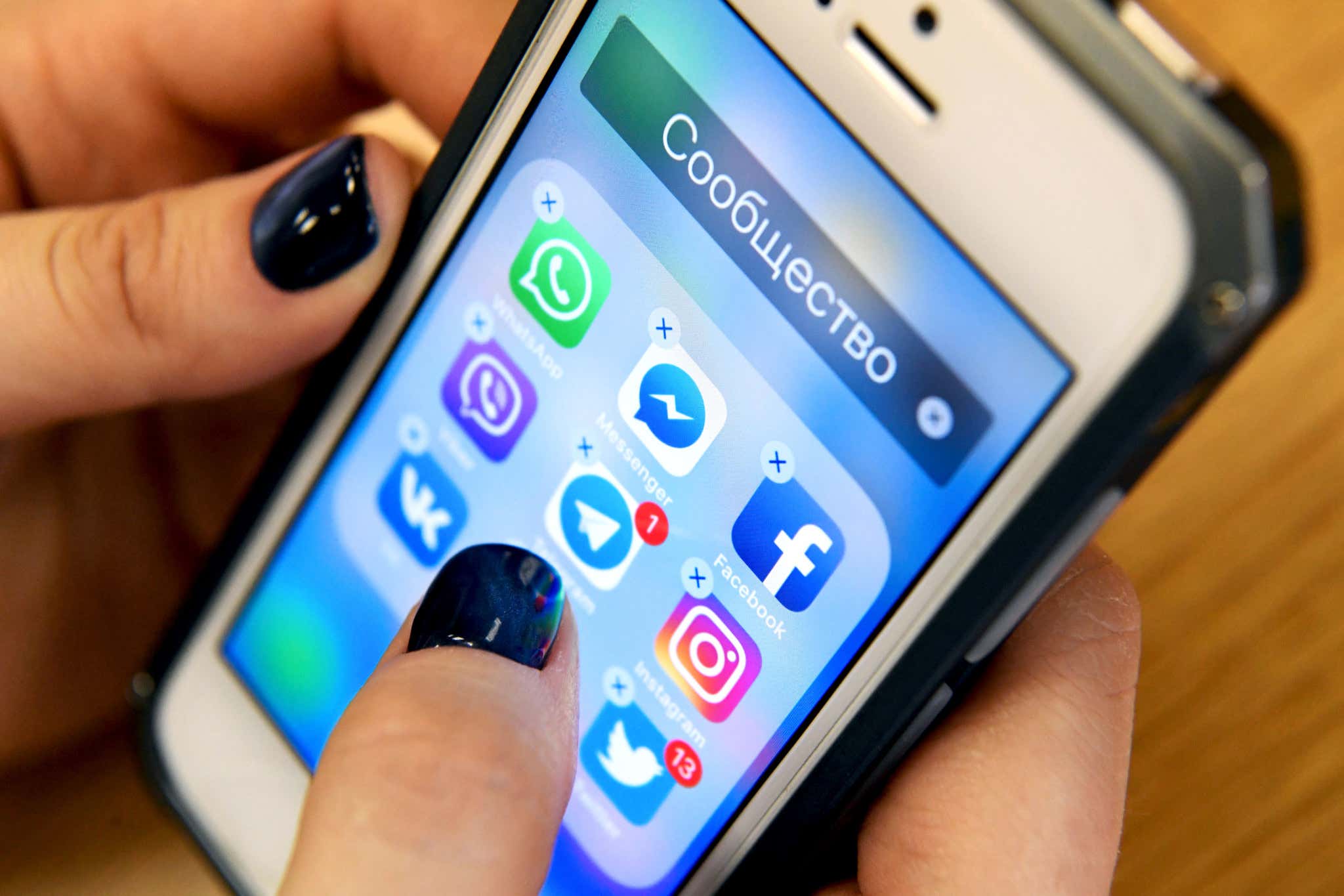 Hand using mobile phone