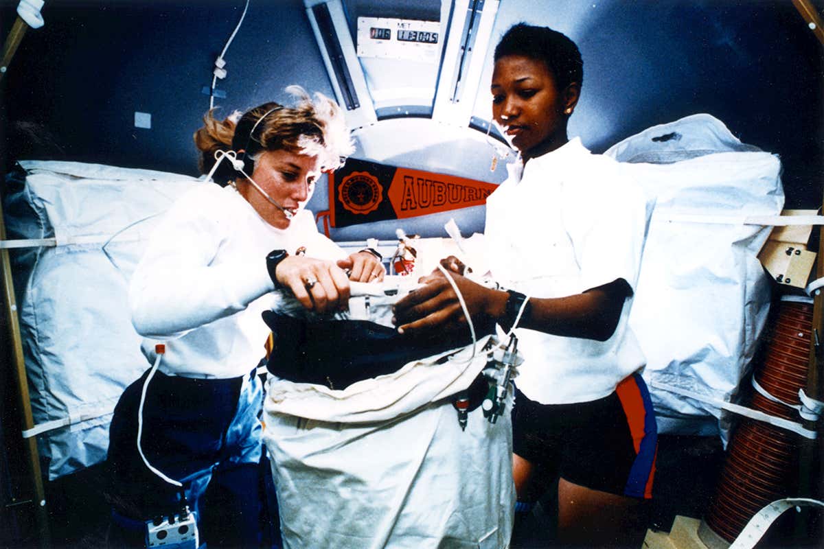Jan Davis and Mae Jemison working on experiments