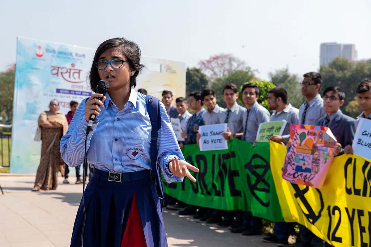 An Indian student speaks in a school strike in New Delhi