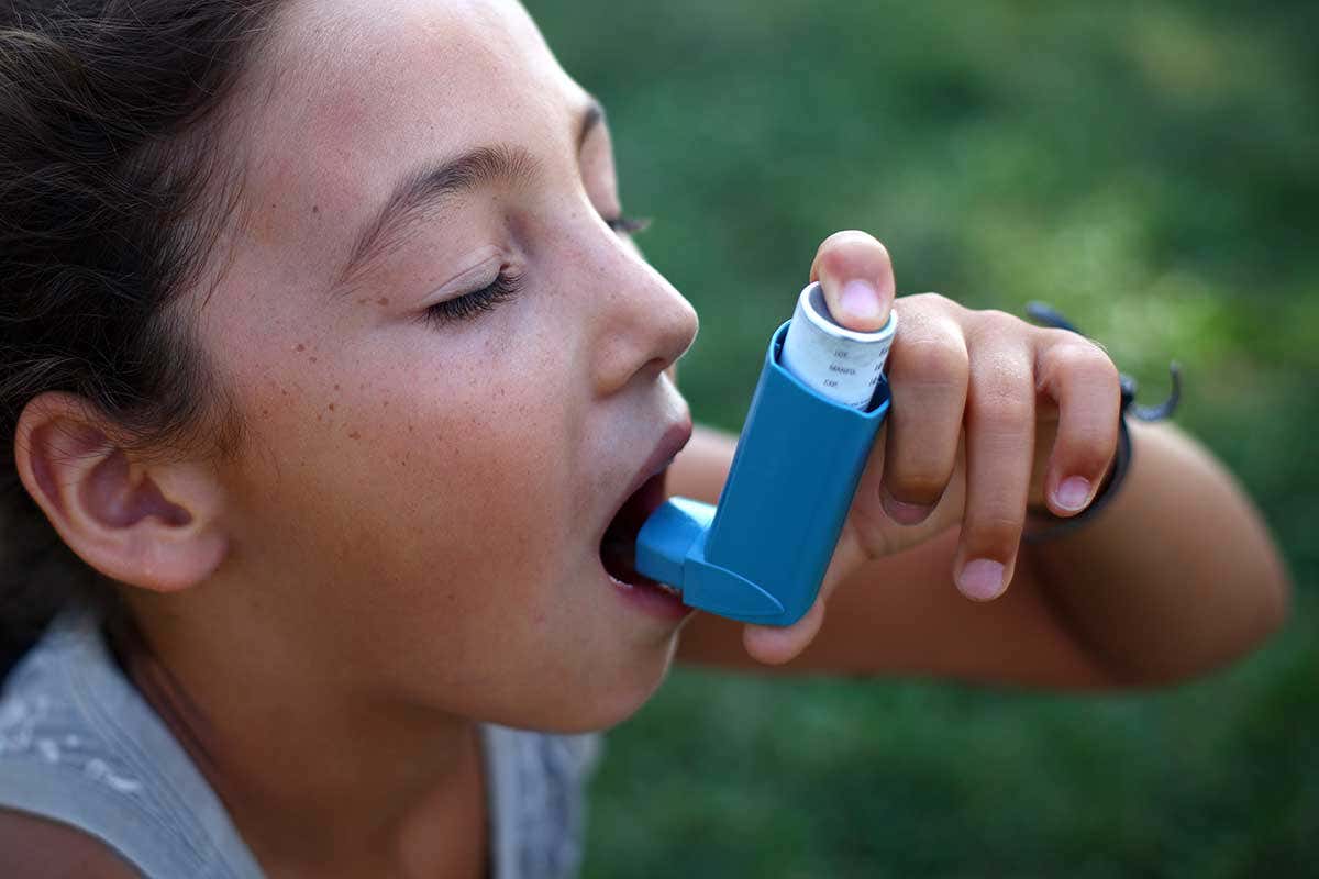 A child uses an inhaler