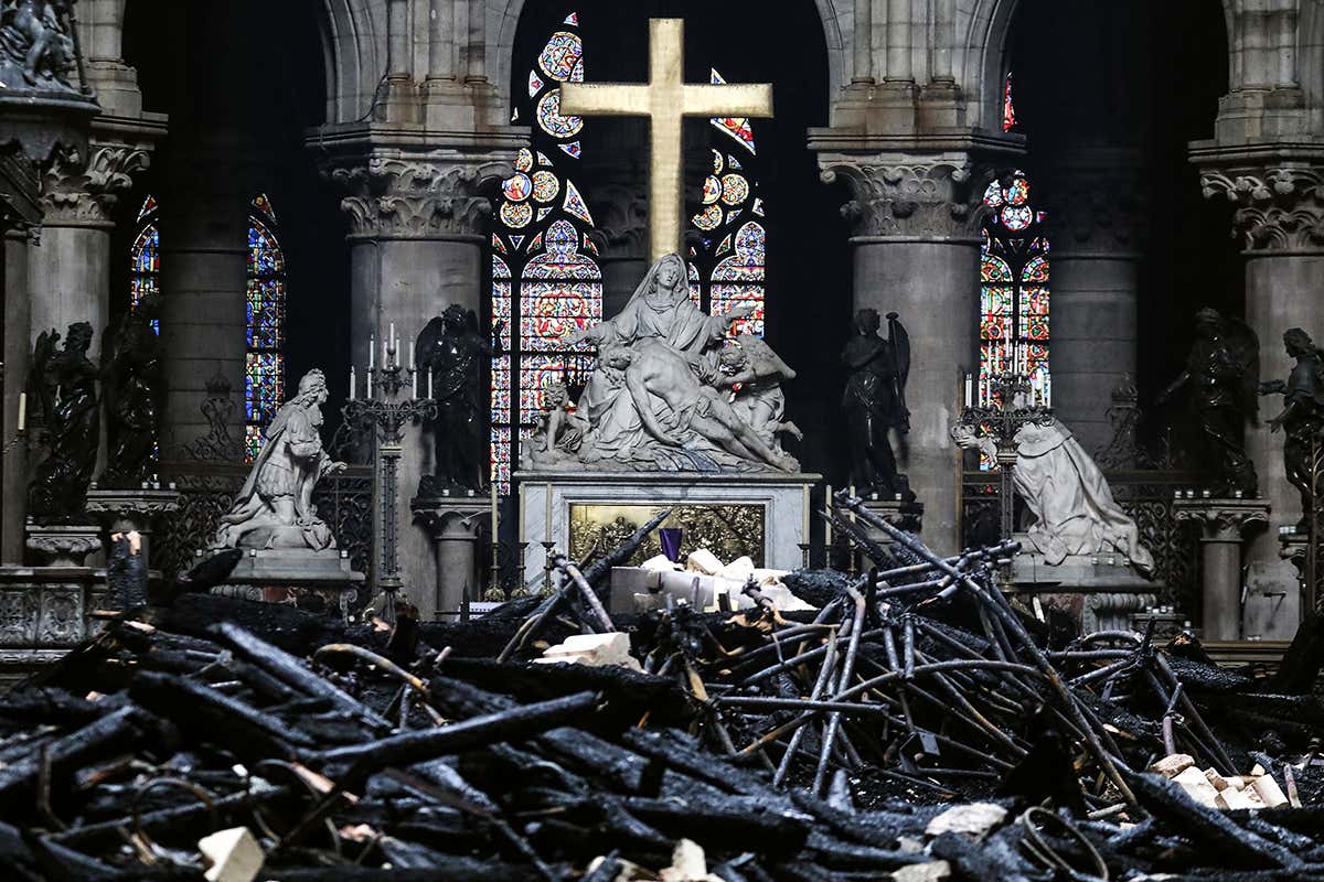 Charred roof debris in front of the cathedral's altar