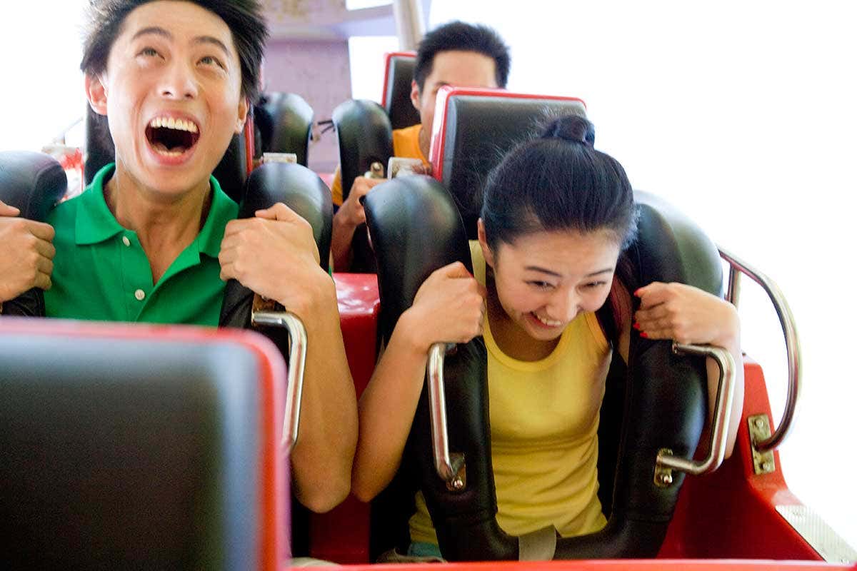People on a rollercoaster