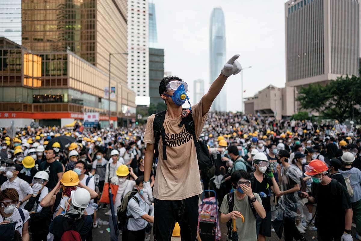 JUNE 12: A protester makes a gesture during a protest on June 12, 2019 in Hong Kong China. Large crowds of protesters gathered in central Hong Kong as the city braced for another mass rally in a show of strength against the government over a divisive plan to allow extraditions to China